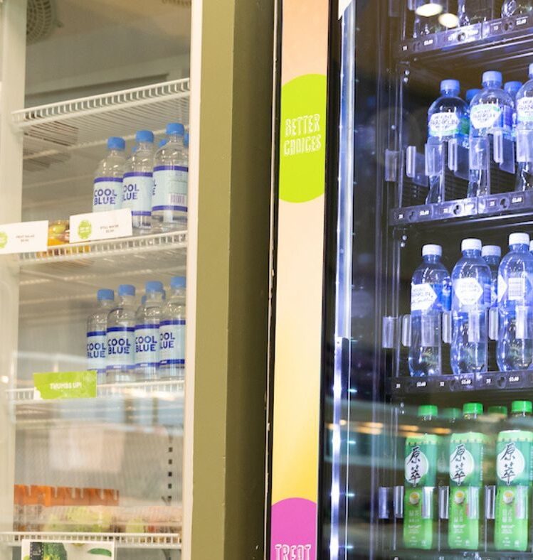 Two fridges containing bottles of water