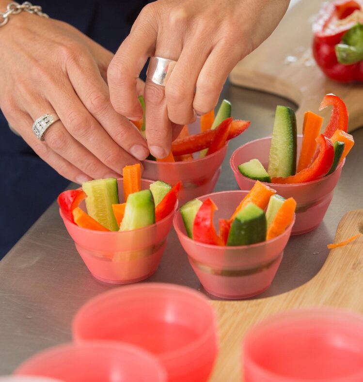 Person making vegetable cups