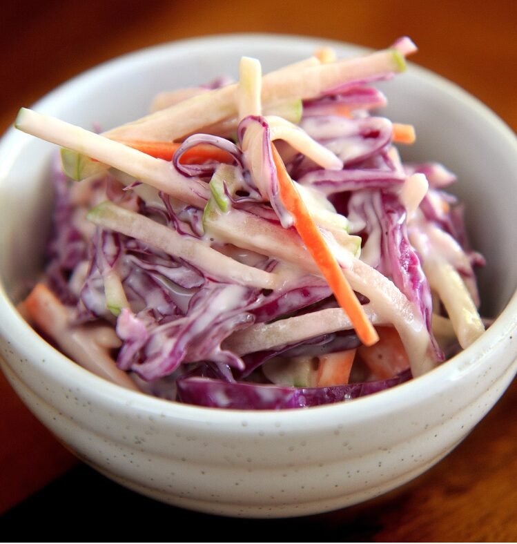 Crunchy coleslaw in white bowl