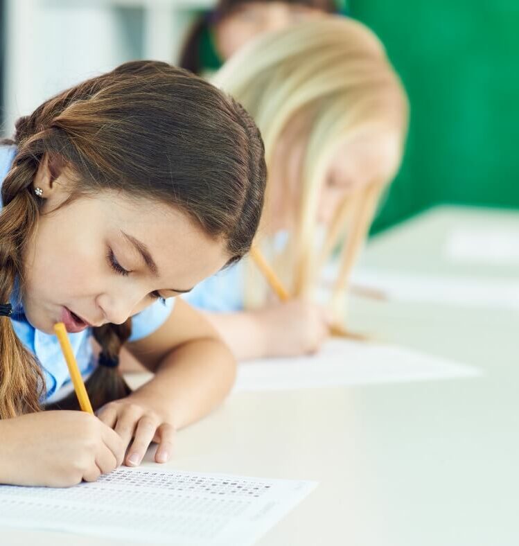 a student filling in a multi-choice test sheet