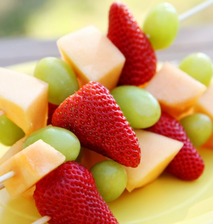 Assorted fruit pieces on skewers
